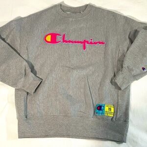Champion reverse weave gray sweatshirt with pink appliqué logo, size large.